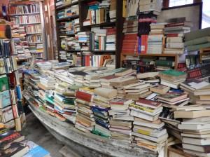 a boat stacked with books