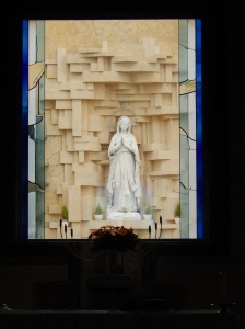 the Madonna as seen through a window of the church