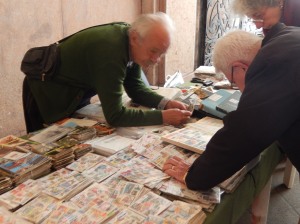 a stamp trader at a little street market