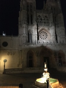 later that evening, in front of the cathedral